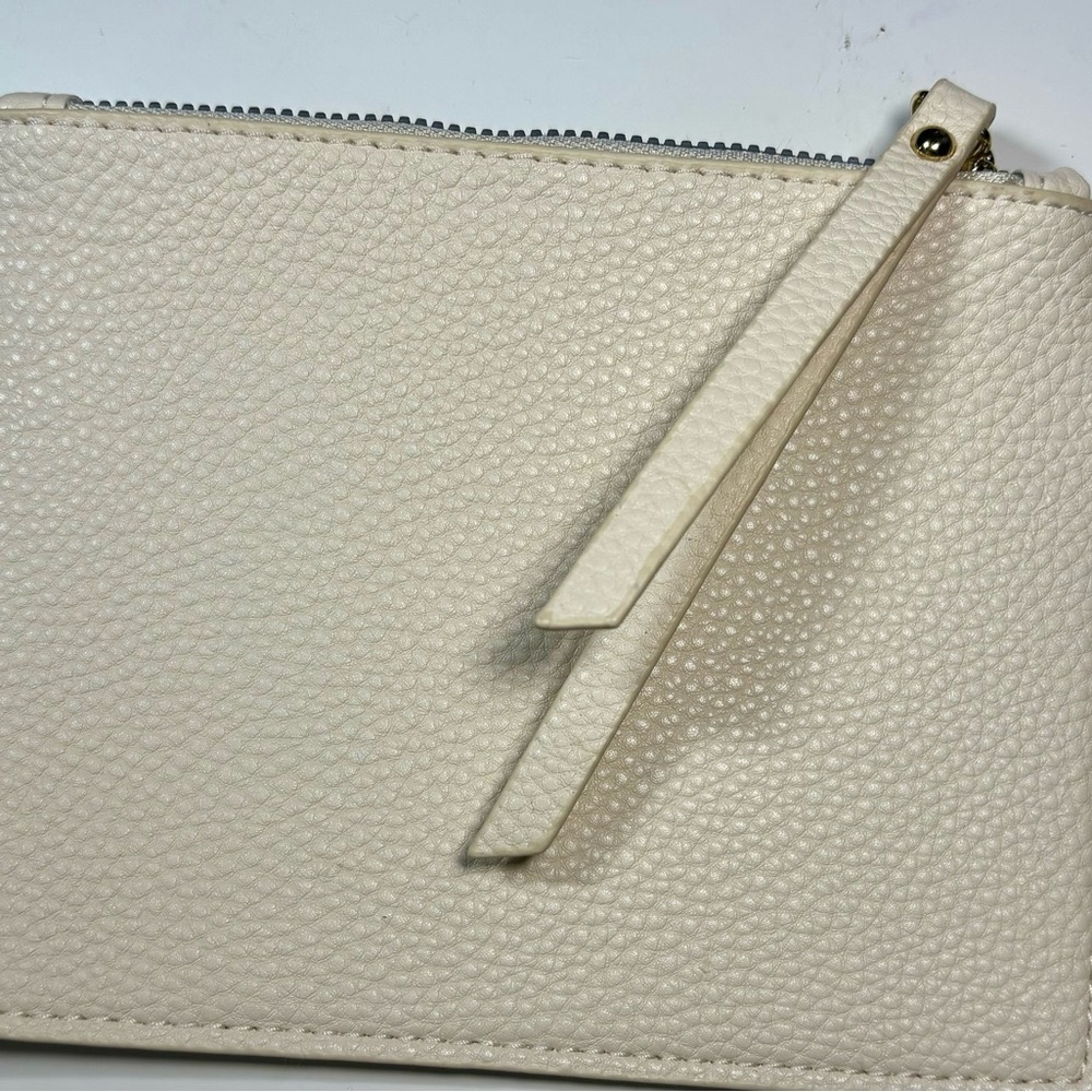 Off white small coin purse .
